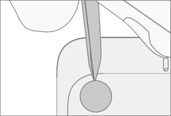 Screenshot that shows a plastic opening pick prying up a foot to expose the screws.