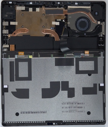 Screenshot that shows partially lifted display module hinged upward exposing internal components