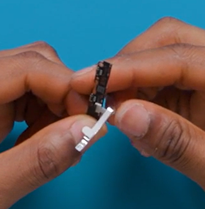 Photo that shows applying the Switch FPC PSA to the underside of the SW FPC.