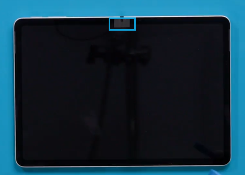 Screenshot that shows debonding tape applied around the front camera cutout on the display module.