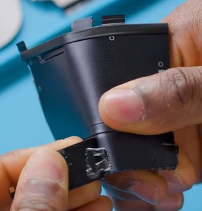 Photo that shows removing the NFC module from the old T1 shield lid.