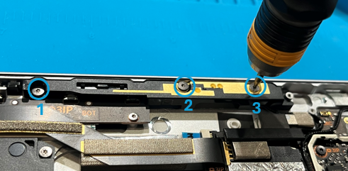 Photo that shows the left antenna deck being removed from the enclosure using a plastic opening tool.